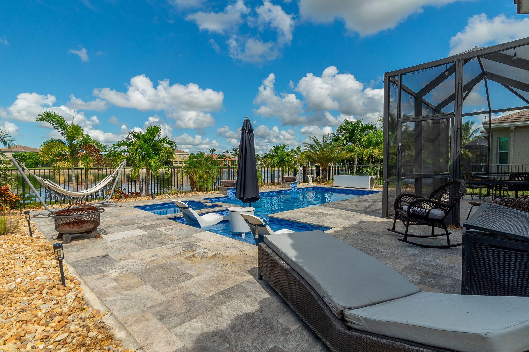3011 Strada Court Royal Palm Beach, FL 33411 - Photo 34 of 57 a view of a backyard with sitting area