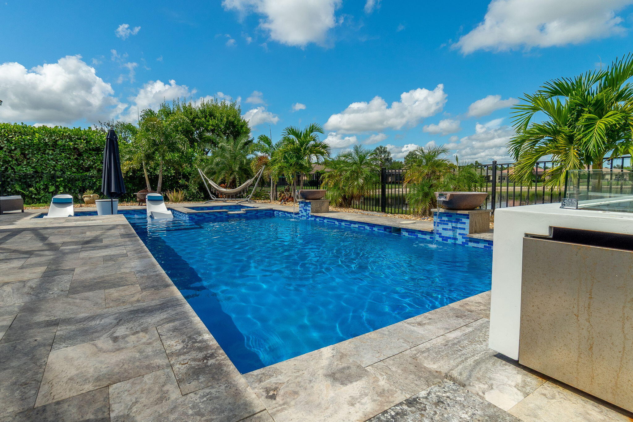 3011 Strada Court Royal Palm Beach, FL 33411 - Photo 35 of 57 a view of a swimming pool with a patio