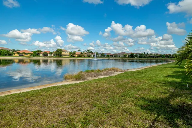 an aerial view of a house with a big yard