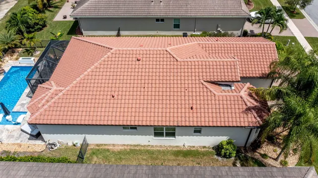 a view of a patio with swimming pool table and chairs