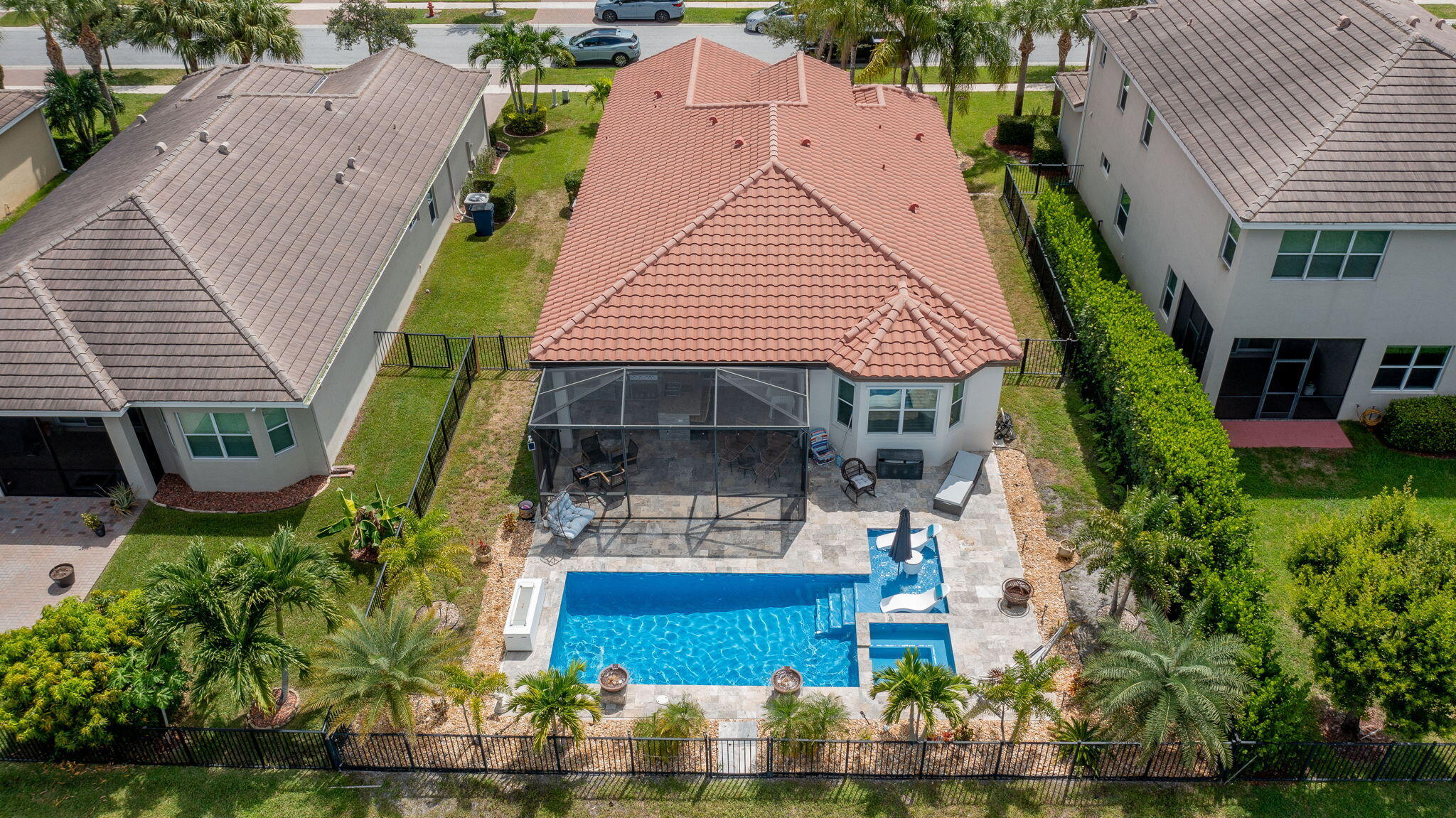 3011 Strada Court Royal Palm Beach, FL 33411 - Photo 43 of 57 an aerial view of a house with garden space and sitting area