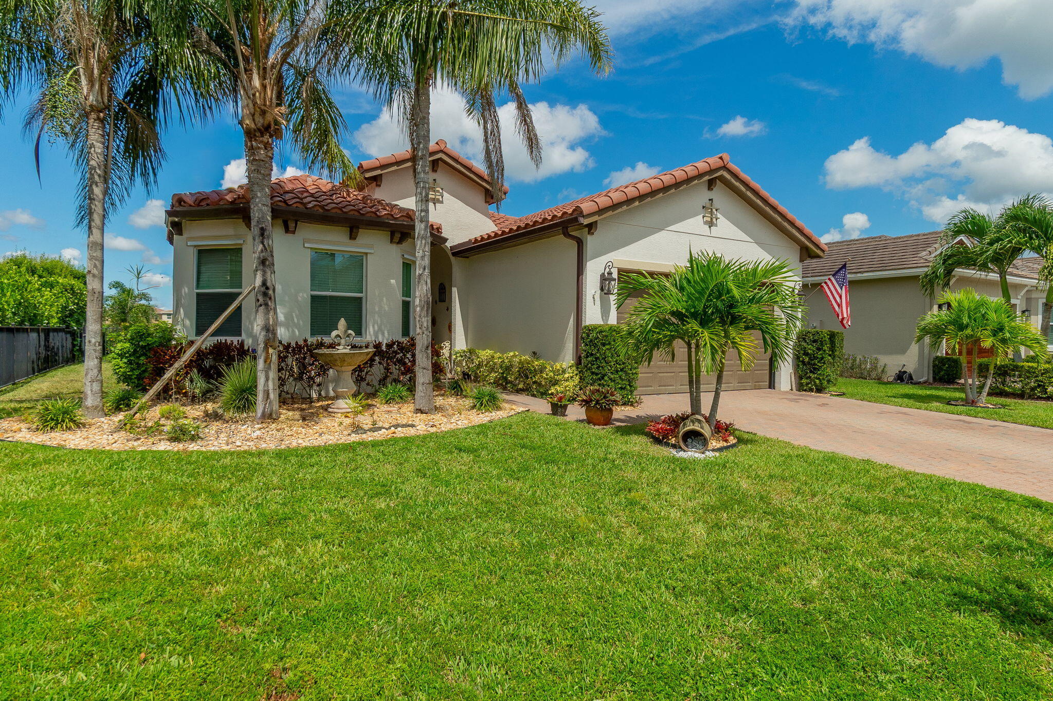 3011 Strada Court Royal Palm Beach, FL 33411 - Photo 5 of 57 a view of a house with swimming pool and a yard