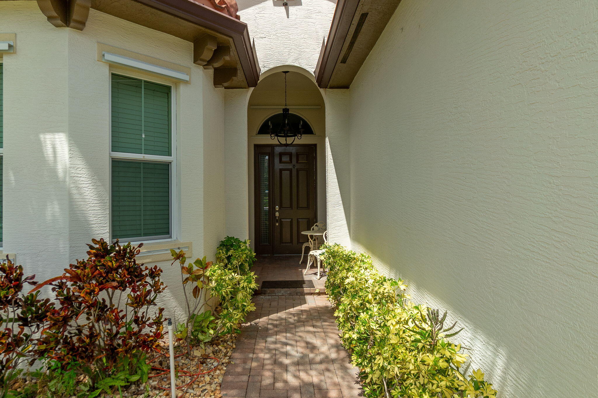 3011 Strada Court Royal Palm Beach, FL 33411 - Photo 6 of 57 a house with a lot of flower plants