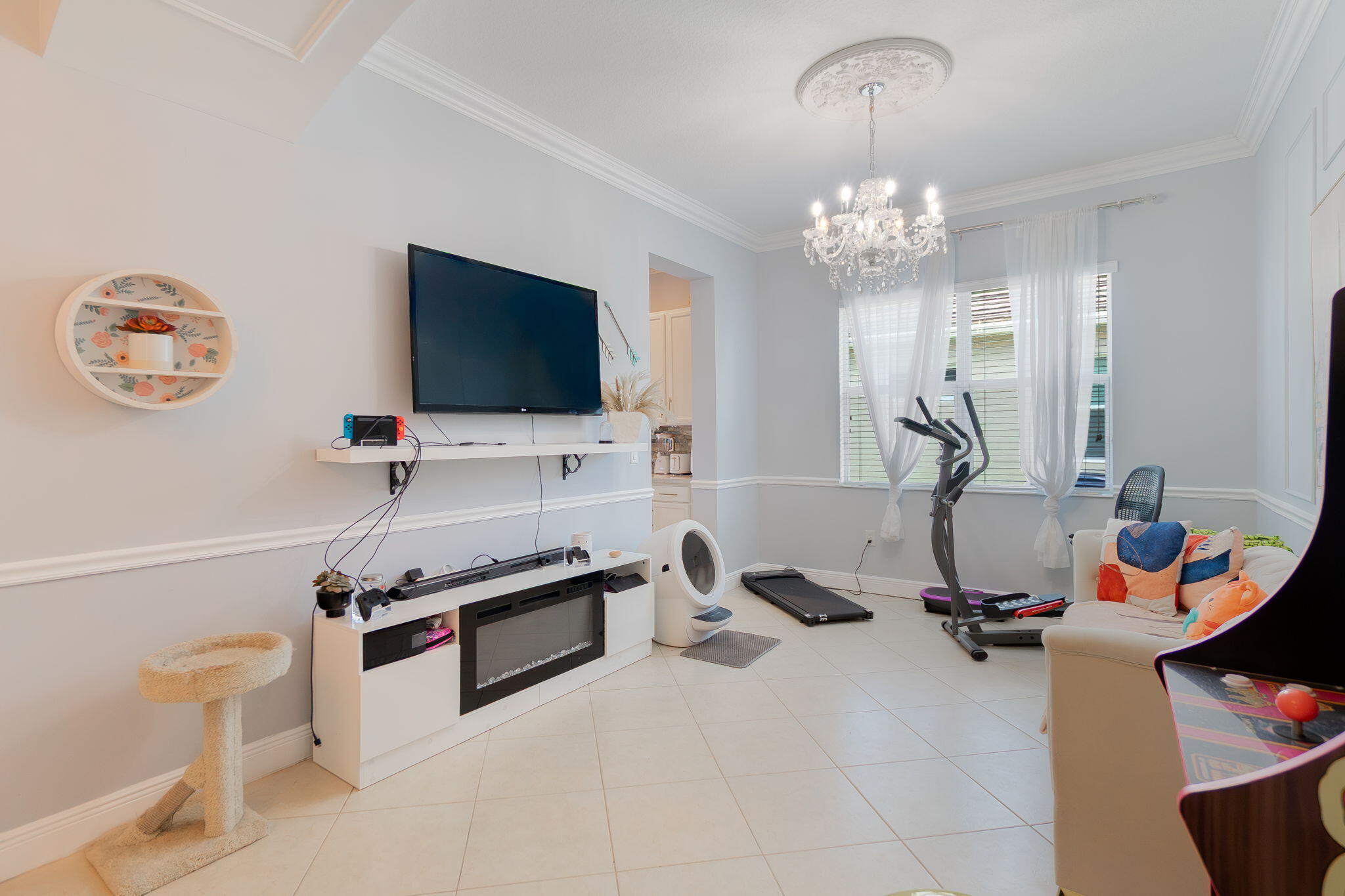 3011 Strada Court Royal Palm Beach, FL 33411 - Photo 9 of 57 a view of a livingroom with furniture and a flat screen tv