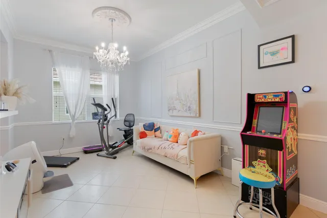 a view of a livingroom with furniture and a flat screen tv