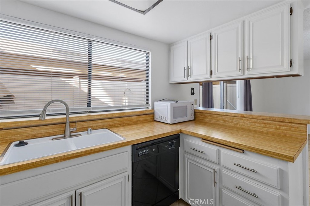 69707 Campana Court Rancho Mirage, CA 92270 - Photo 15 of 47 a kitchen with a sink and cabinets