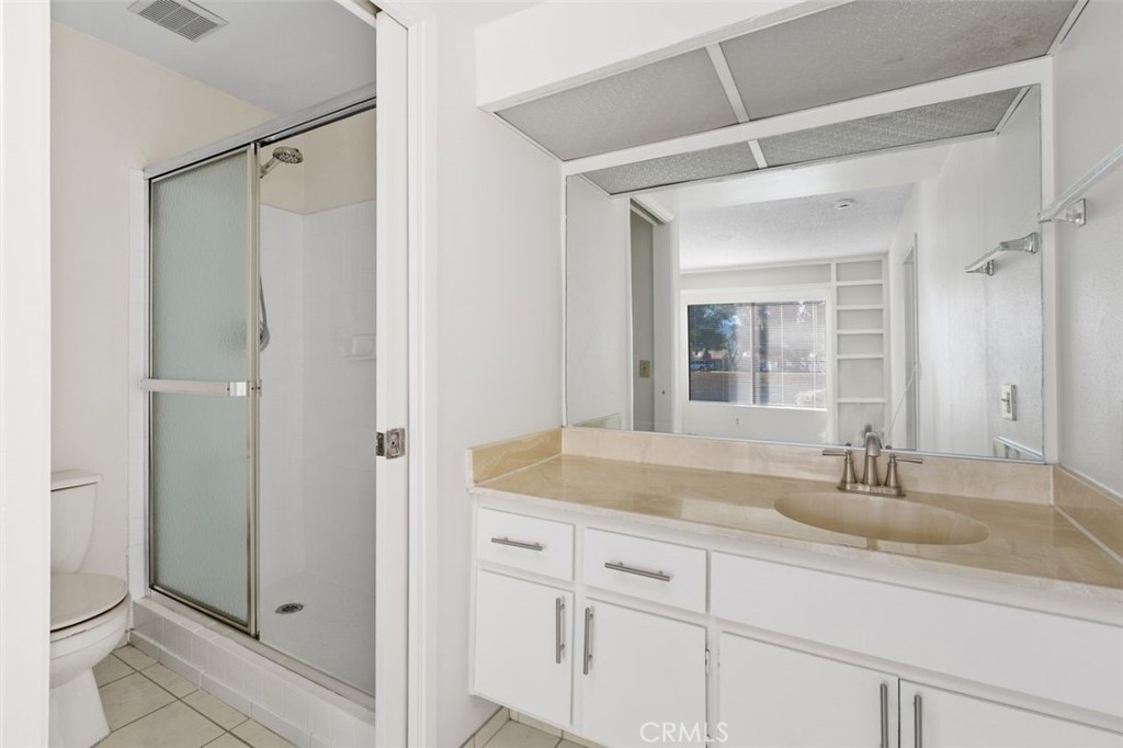 69707 Campana Court Rancho Mirage, CA 92270 - Photo 21 of 47 a bathroom with a sink and a mirror