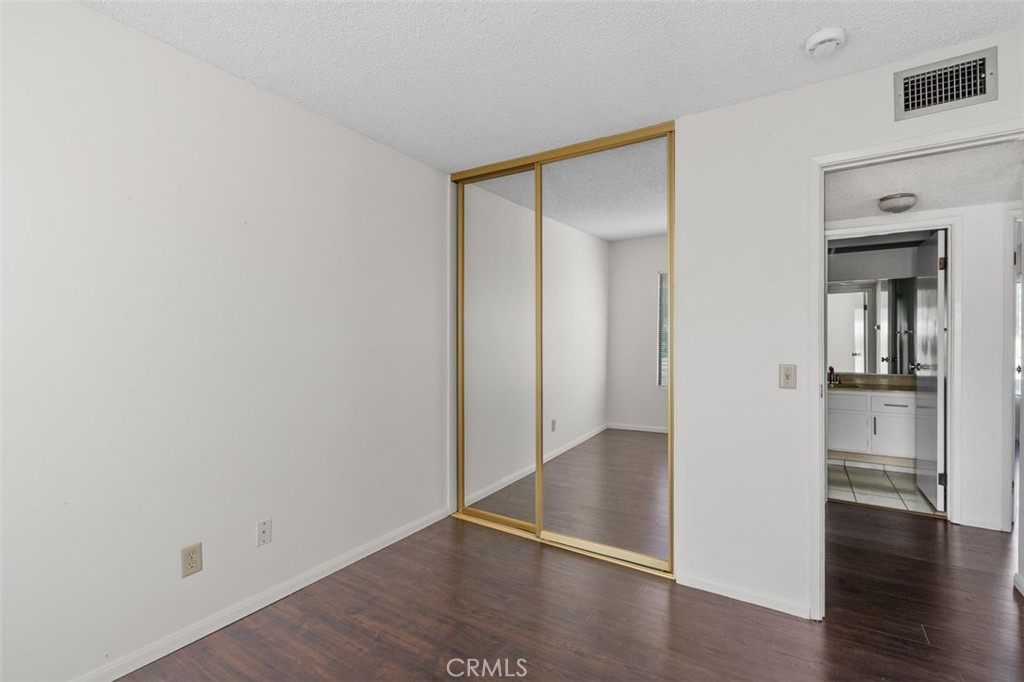 69707 Campana Court Rancho Mirage, CA 92270 - Photo 25 of 47 a view of an empty room with wooden floor