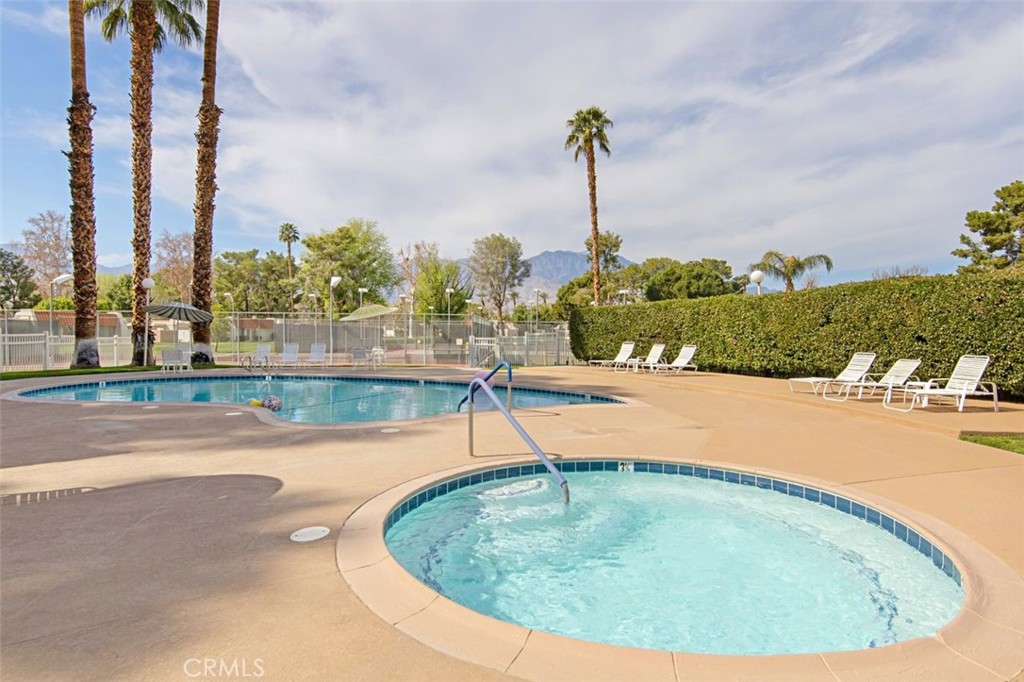 69707 Campana Court Rancho Mirage, CA 92270 - Photo 41 of 47 a view of a swimming pool with a yard