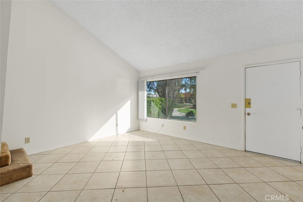 69707 Campana Court Rancho Mirage, CA 92270 - Photo 5 of 47 a view of an empty room with a window