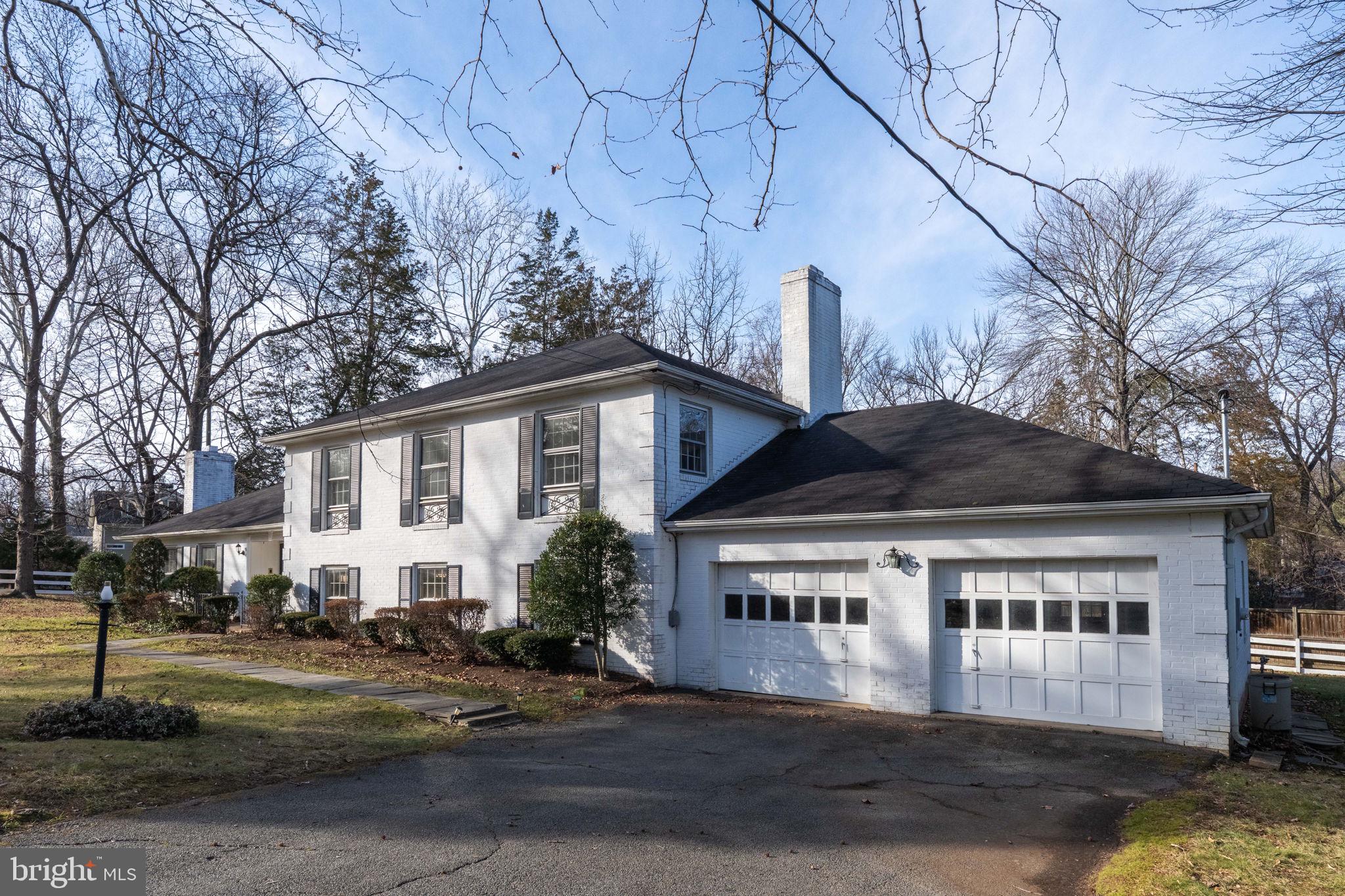 6008 Beech Tree Drive Alexandria, VA 22310 - Photo 4 of 9 a front view of a house with a yard