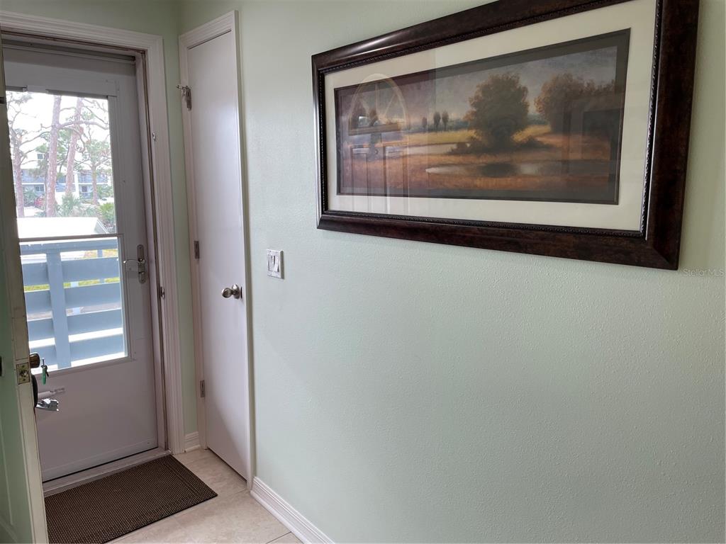 6800 Placida Road, Unit 268 Englewood, FL 34224 - Photo 7 of 33 a view of a hallway with a painting on the wall