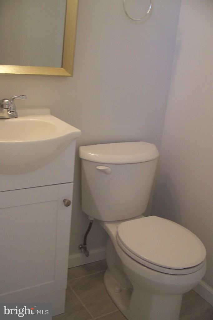 8442 Bedford Road Pasadena, MD 21122 - Photo 13 of 24 All New Half Bath off Kitchen