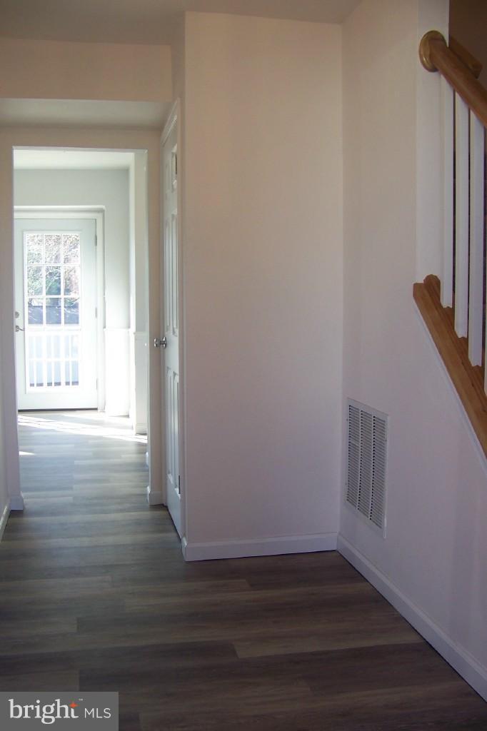 8442 Bedford Road Pasadena, MD 21122 - Photo 3 of 24 Center Hallway with New Flooring