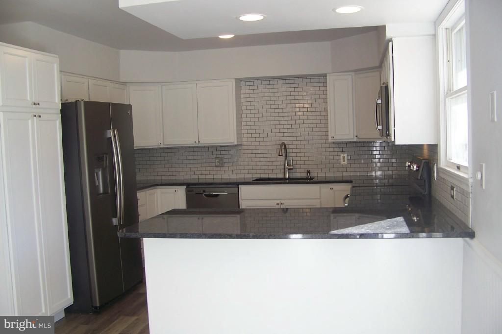 8442 Bedford Road Pasadena, MD 21122 - Photo 4 of 24 New Kitchen & Breakfast Bar w/Granite Counters