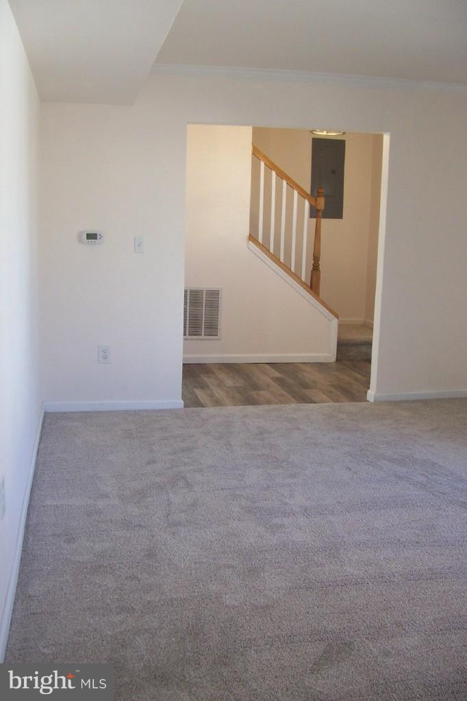 8442 Bedford Road Pasadena, MD 21122 - Photo 10 of 24 Living Room with View to Center Hallway