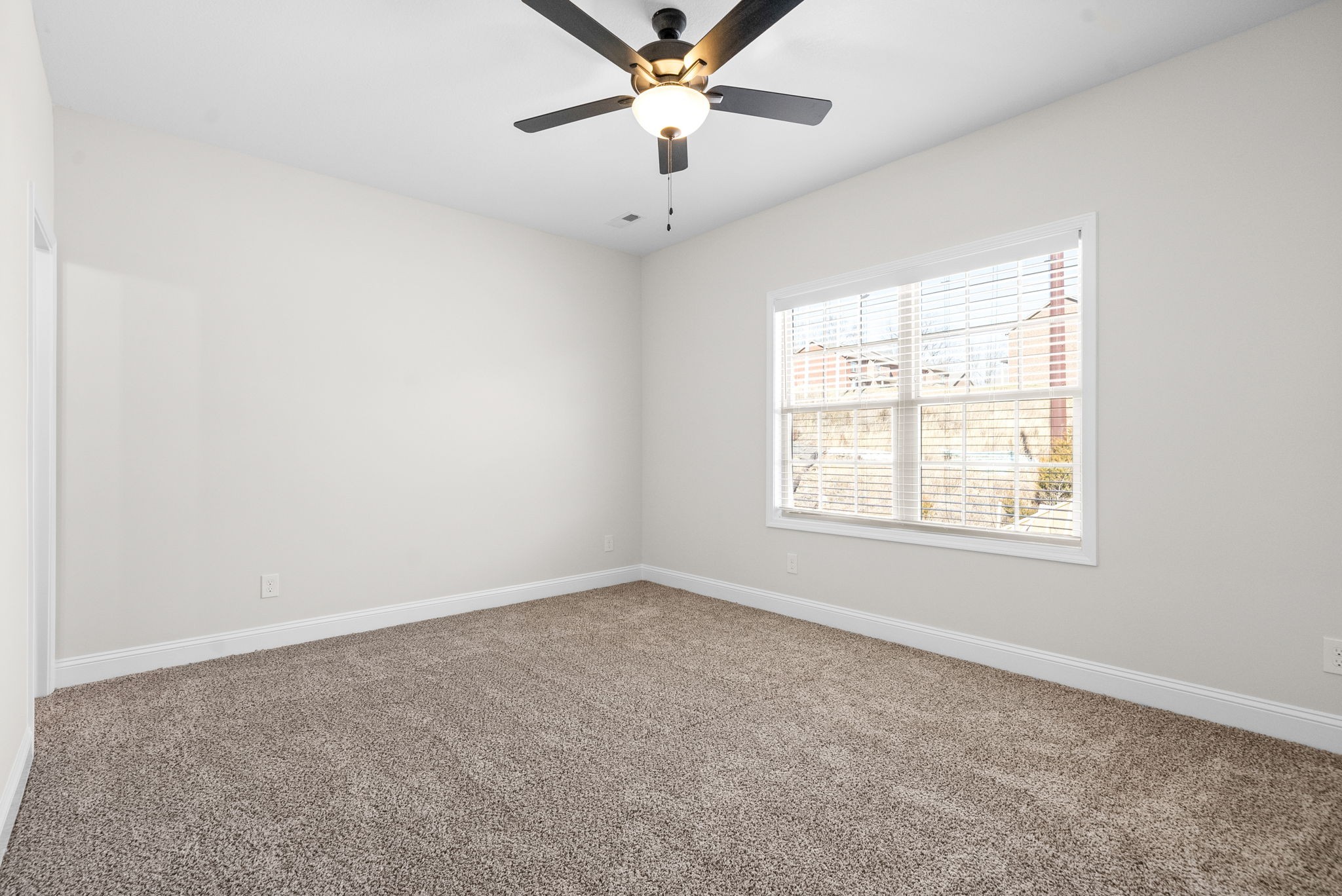 500 Peachers Mill Road, Unit C1 Clarksville, TN 37042 - Photo 12 of 31 an empty room with a window and a fan
