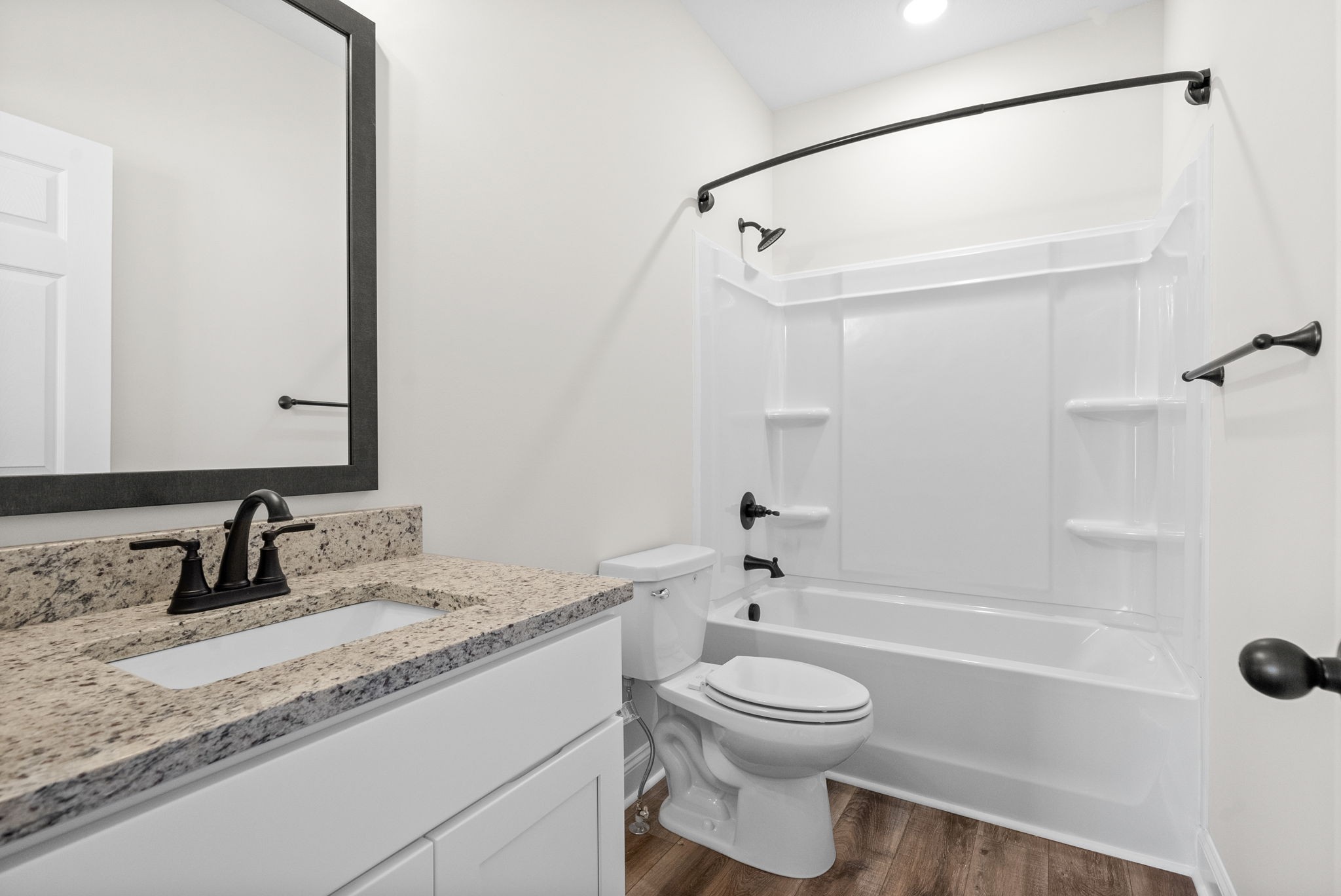 500 Peachers Mill Road, Unit C1 Clarksville, TN 37042 - Photo 14 of 31 a bathroom with a granite countertop sink toilet and shower