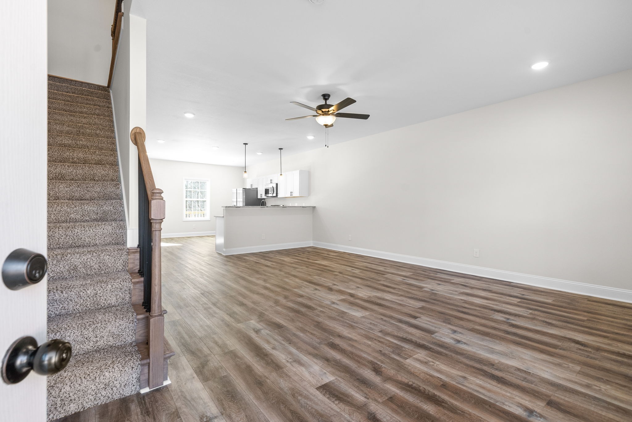 500 Peachers Mill Road, Unit C1 Clarksville, TN 37042 - Photo 2 of 31 wooden floor in an empty room with a window