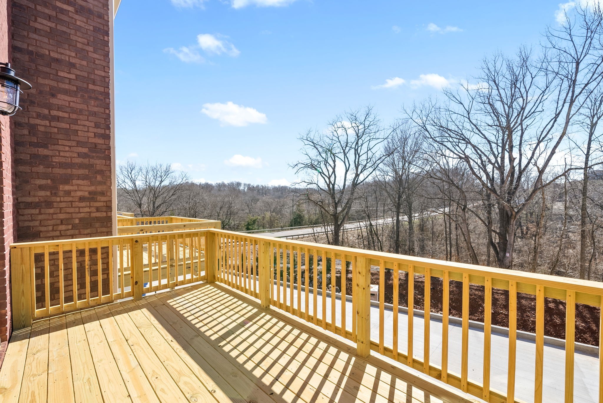 500 Peachers Mill Road, Unit C1 Clarksville, TN 37042 - Photo 24 of 31 a view of a balcony with wooden floor and fence