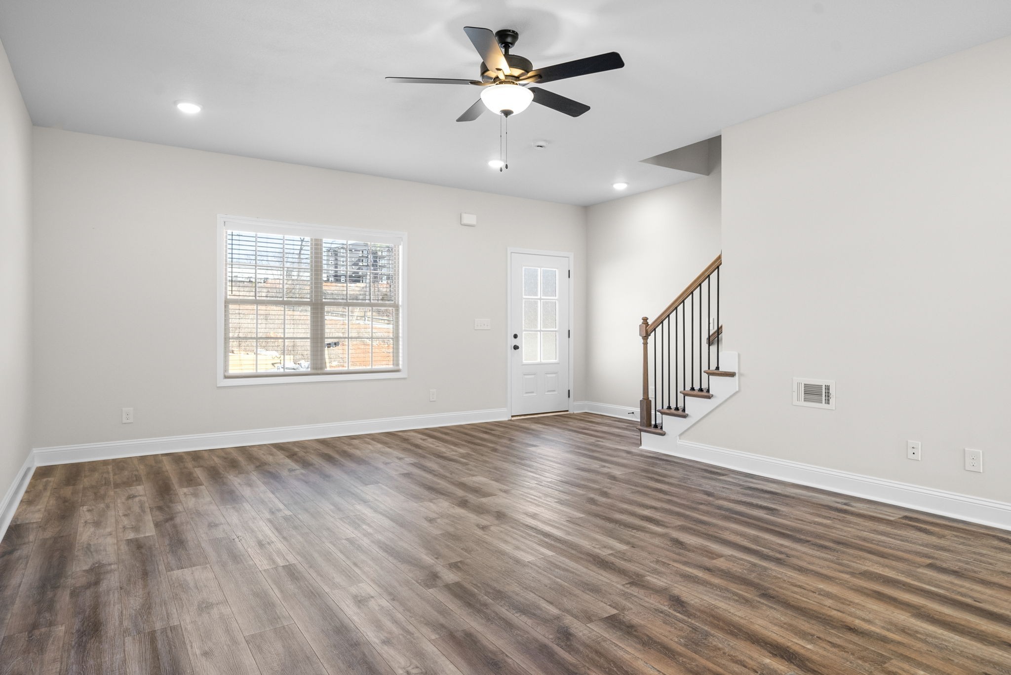 500 Peachers Mill Road, Unit C1 Clarksville, TN 37042 - Photo 4 of 31 wooden floor in an empty room with a window