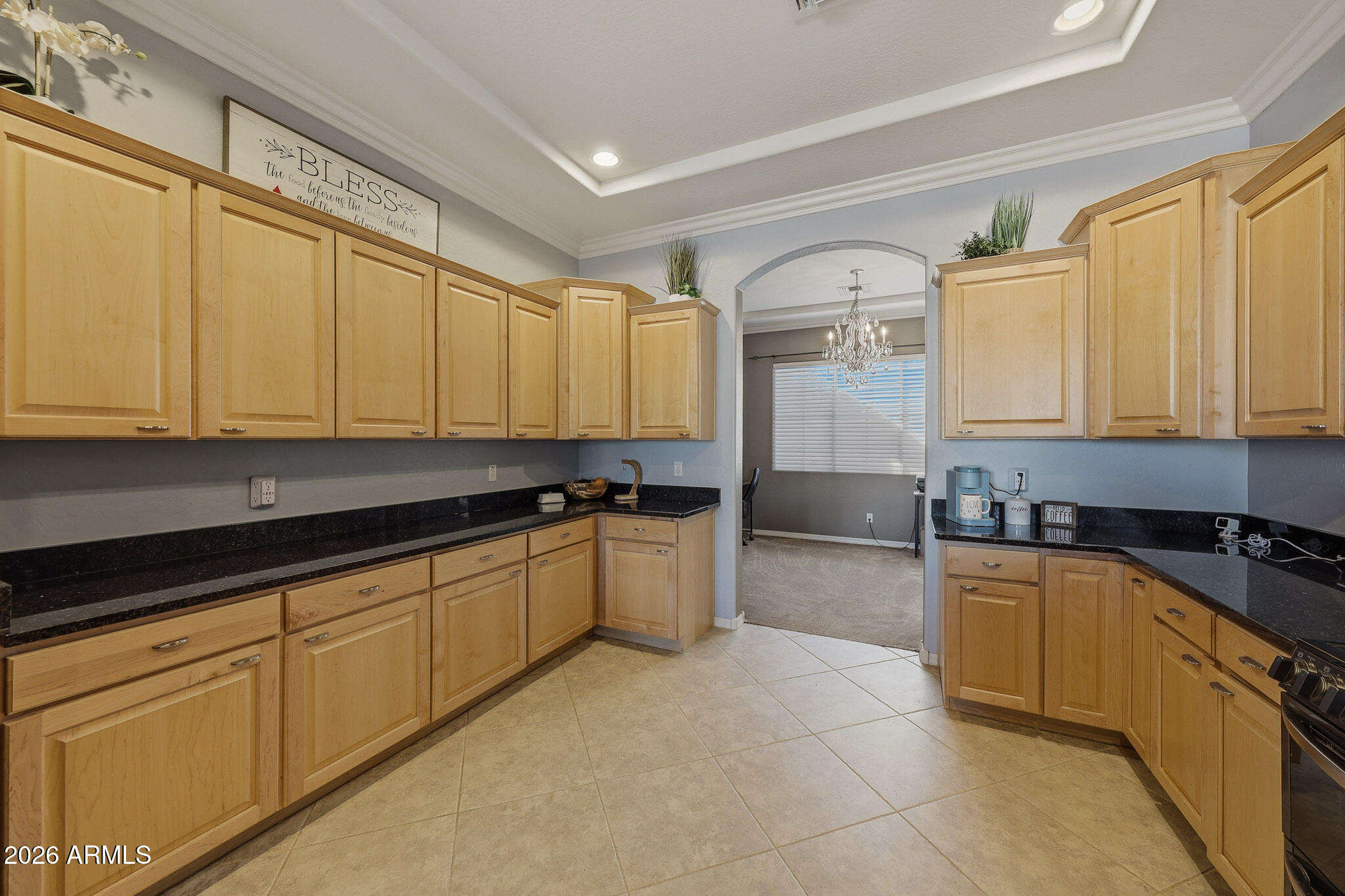 23024 West Sierra Ridge Way Wittmann, AZ 85361 - Photo 32 of 99 a kitchen with stainless steel appliances granite countertop a sink and cabinets