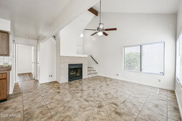 a view of empty room with a fireplace