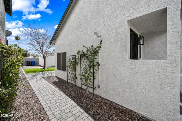 a view of house with backyard