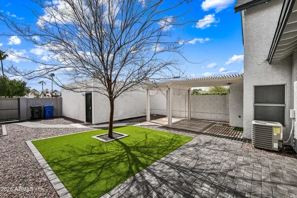 a backyard of a house with seating space