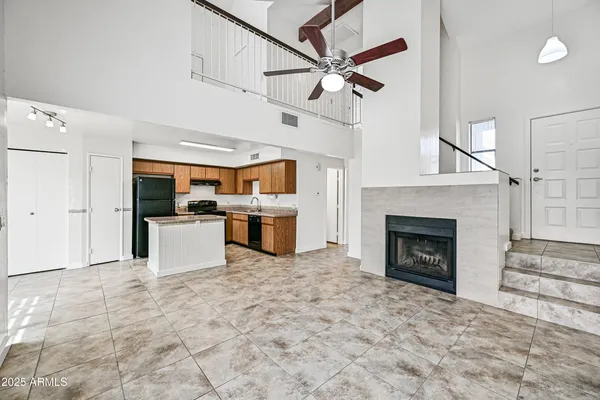 a view of a kitchen with furniture and a fireplace