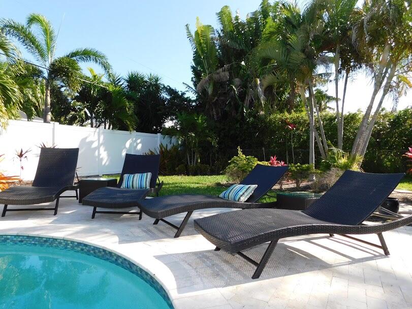 1150 Emerald Lane Singer Island, FL 33404 - Photo 16 of 25 a view of a backyard with sitting area