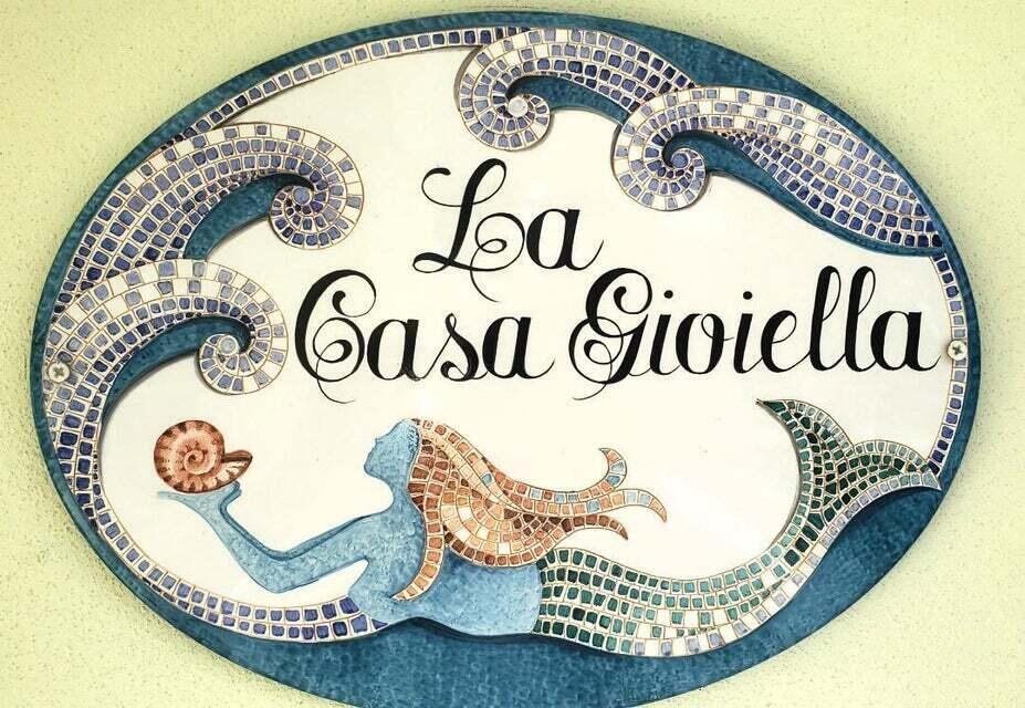 1150 Emerald Lane Singer Island, FL 33404 - Photo 2 of 25 a view of a table in a wooden chairs