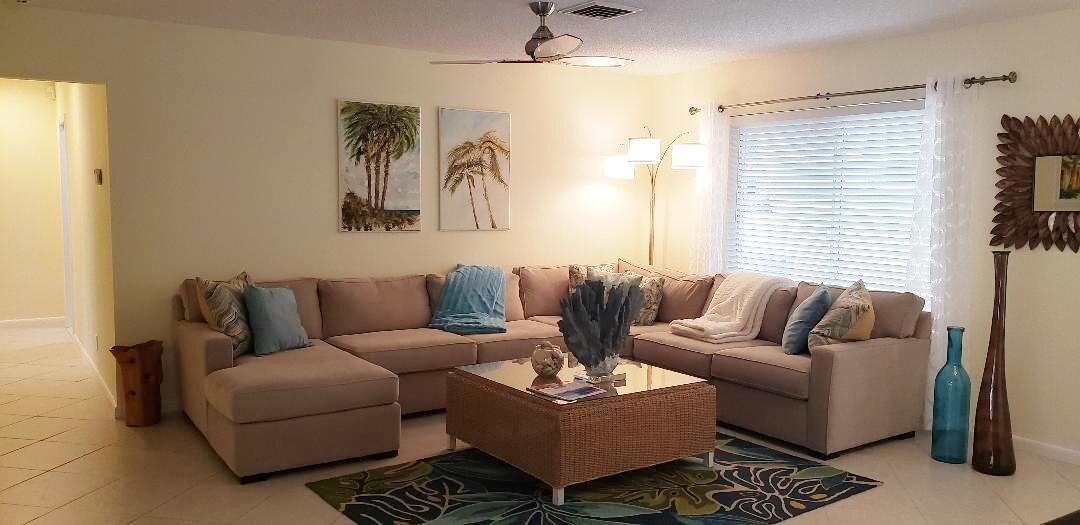 1150 Emerald Lane Singer Island, FL 33404 - Photo 5 of 25 a living room with furniture and a window