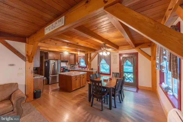 a living room with furniture a couch and a window