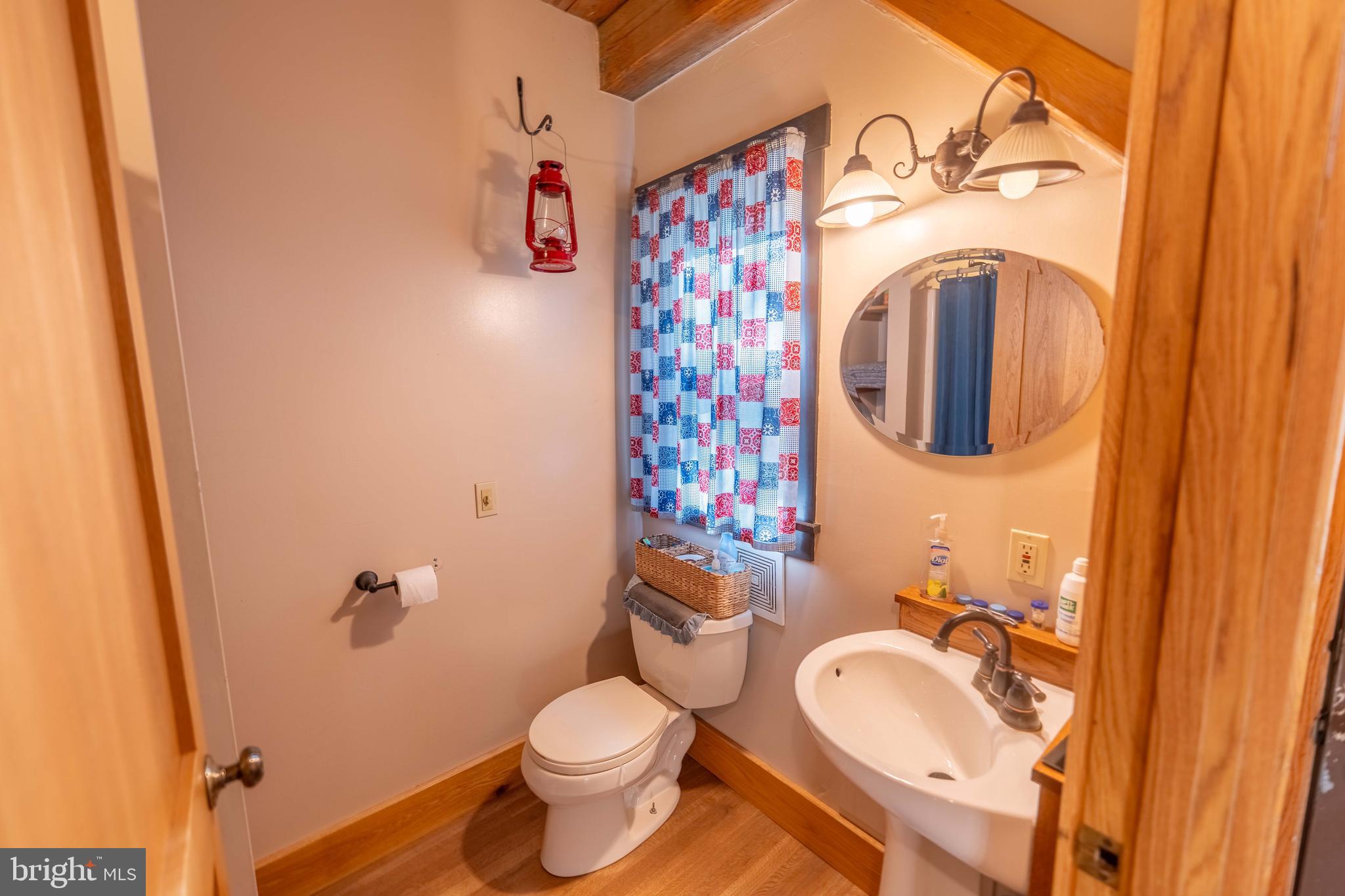 3171 Ritner Highway Newville, PA 17241 - Photo 16 of 63 a bathroom with a granite countertop toilet and a sink