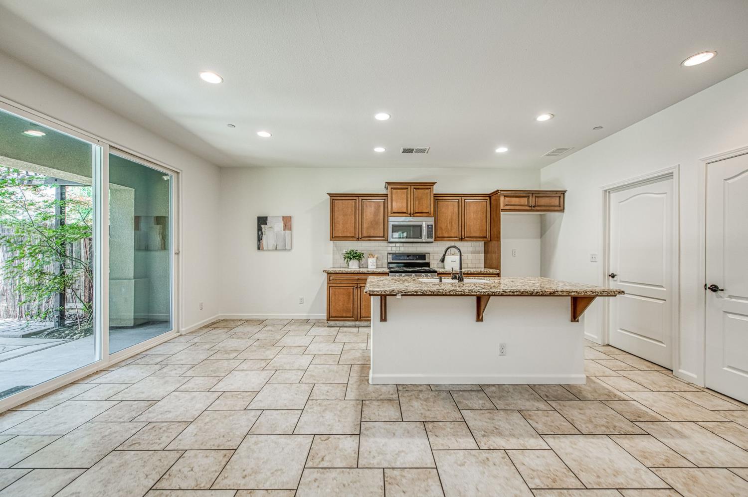 3521 Buckingham Avenue Clovis, CA 93619 - Photo 13 of 33 a view of kitchen with microwave and cabinets