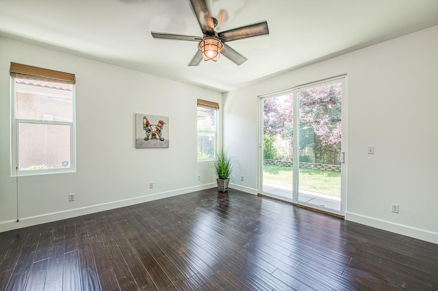3521 Buckingham Avenue Clovis, CA 93619 - Photo 23 of 33 a view of an empty room with wooden floor and a window