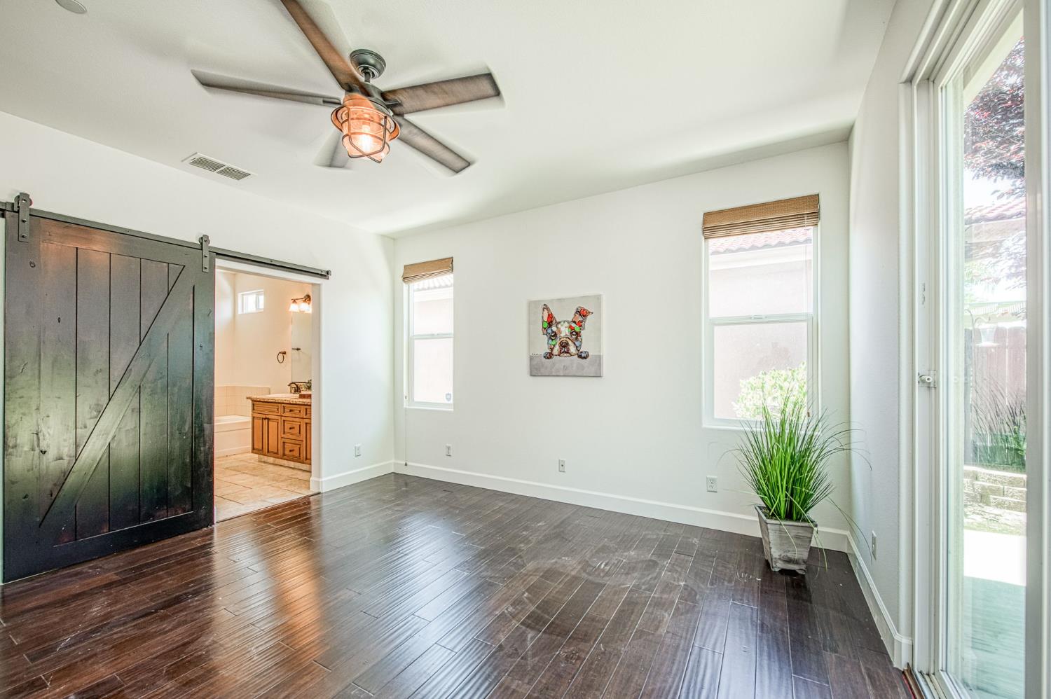 3521 Buckingham Avenue Clovis, CA 93619 - Photo 24 of 33 wooden floor in an empty room with a window