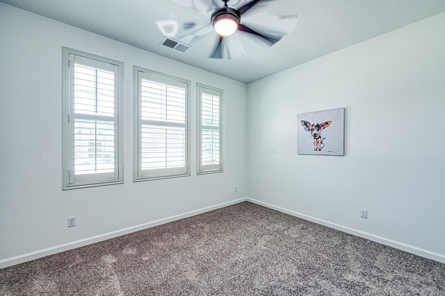 3521 Buckingham Avenue Clovis, CA 93619 - Photo 6 of 33 a view of empty room with window and ceiling fan