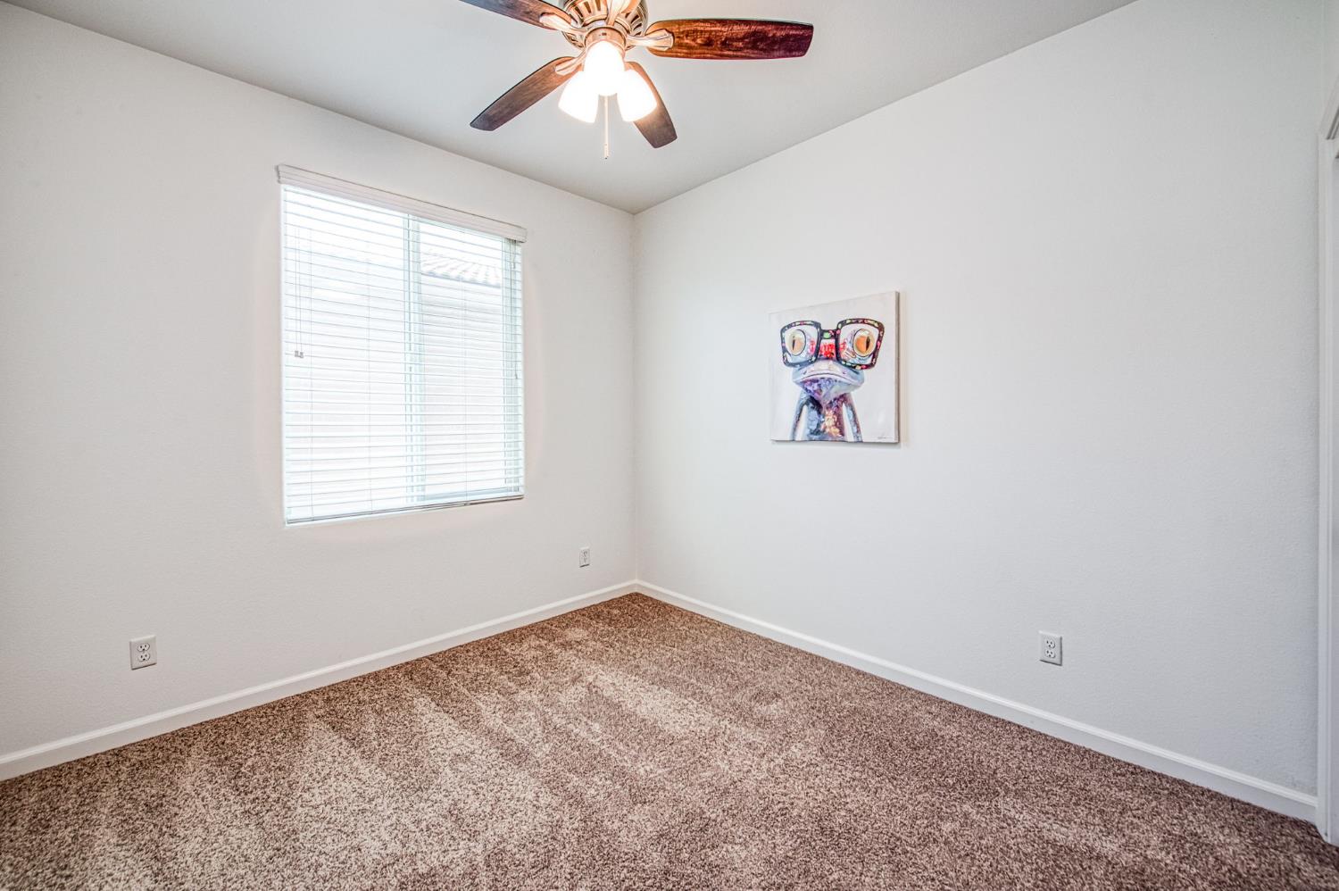 3521 Buckingham Avenue Clovis, CA 93619 - Photo 9 of 33 an empty room with a window