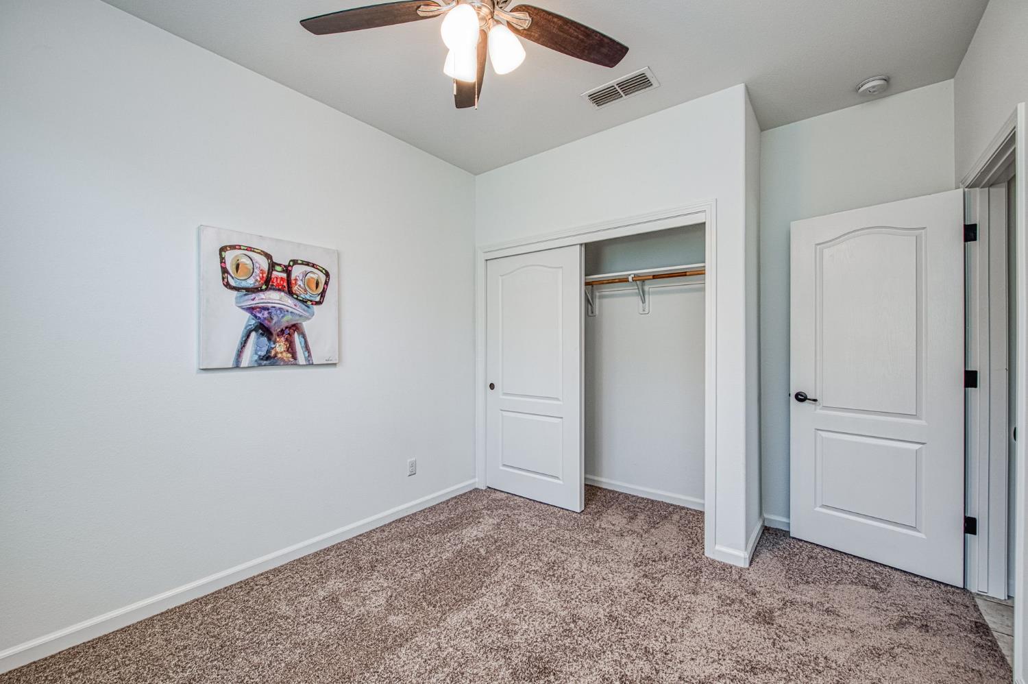 3521 Buckingham Avenue Clovis, CA 93619 - Photo 10 of 33 wooden floor in an empty room