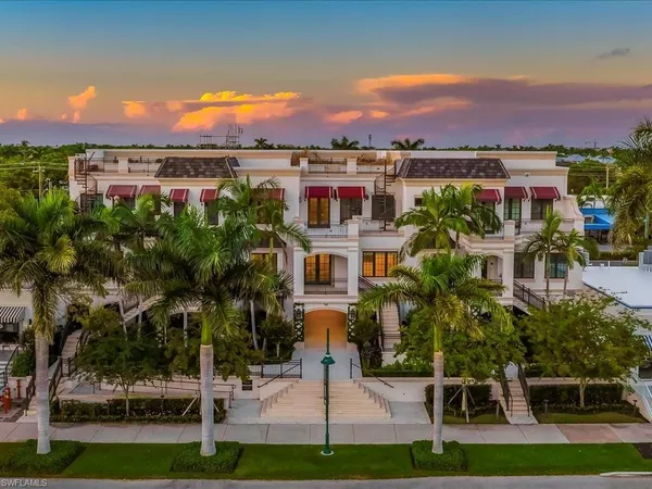 a view of a patio with table and chairs and potted plants