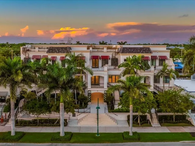 a view of a patio with table and chairs and potted plants