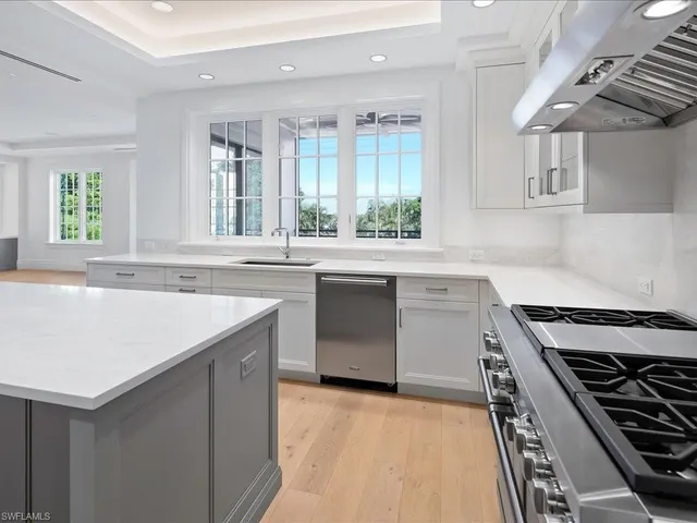 a kitchen with a stove and a sink