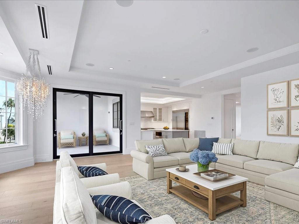 745 12th Avenue South, Unit 102 Naples, FL 34102 - Photo 20 of 50 a living room with furniture and a rug