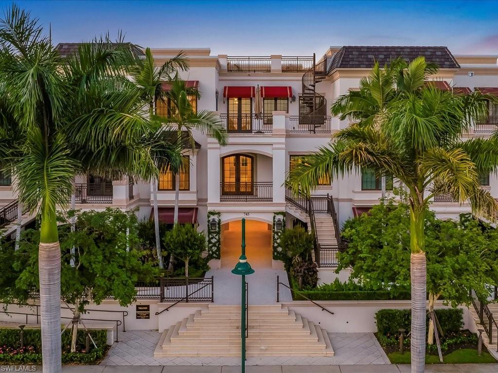 745 12th Avenue South, Unit 102 Naples, FL 34102 - Photo 2 of 50 a front view of multiple houses with yard