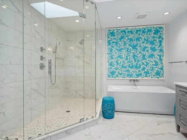 a bathroom with a shower and a bathtub