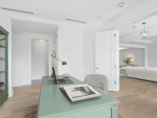 a living room with furniture and a table