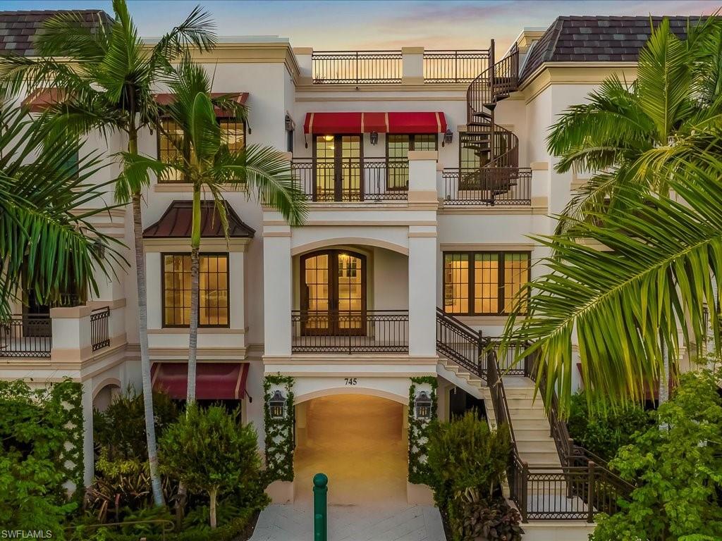 745 12th Avenue South, Unit 102 Naples, FL 34102 - Photo 3 of 50 a front view of a multi story residential apartment building