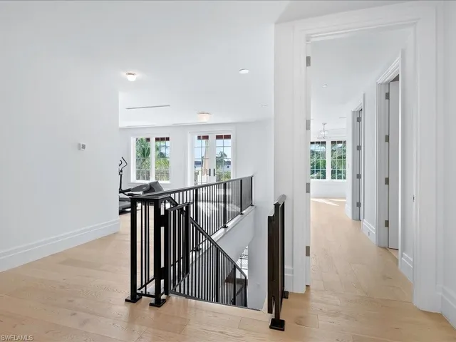 en view interior of a house with wooden floor and stairs